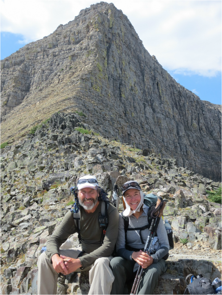 Hikers, w Triple Divide Peak in the background